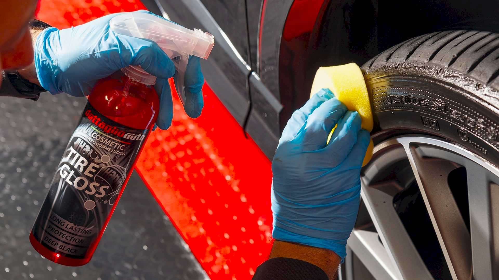 exterior car detailing with the application of a cream on a wheel