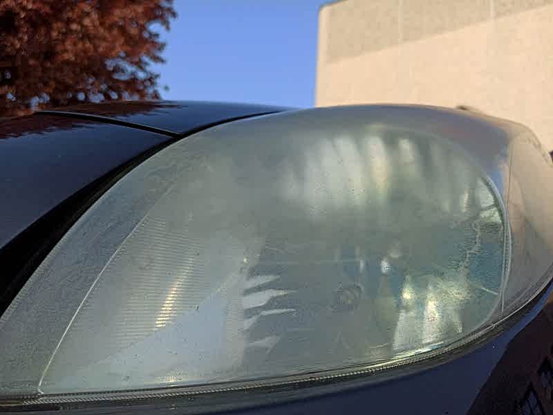Cloudy car headlights.