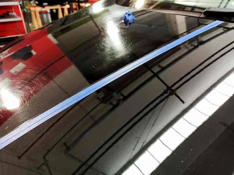 Half car hood covered in swirls and other half perfectly polished